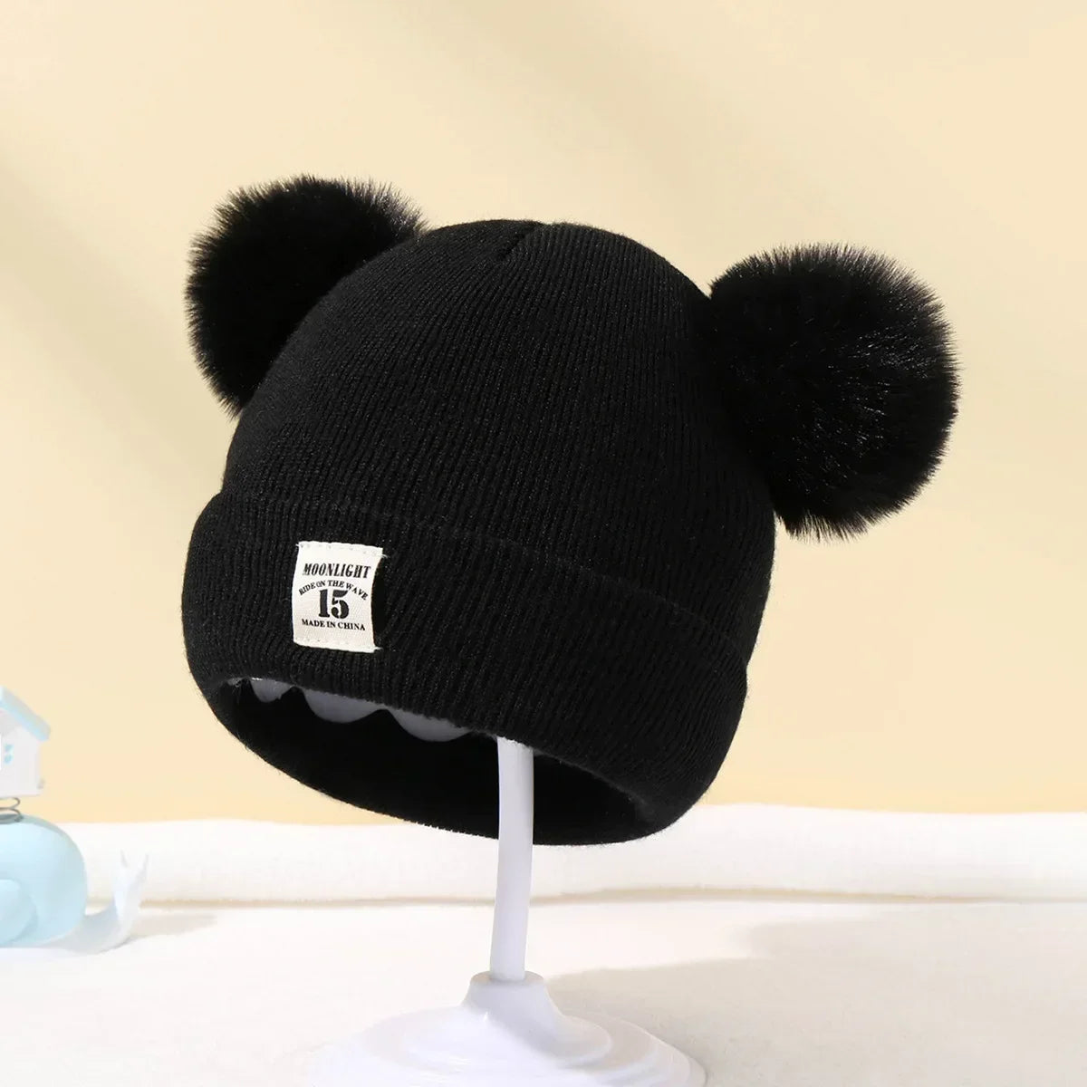 Gorro de bebé con pompones