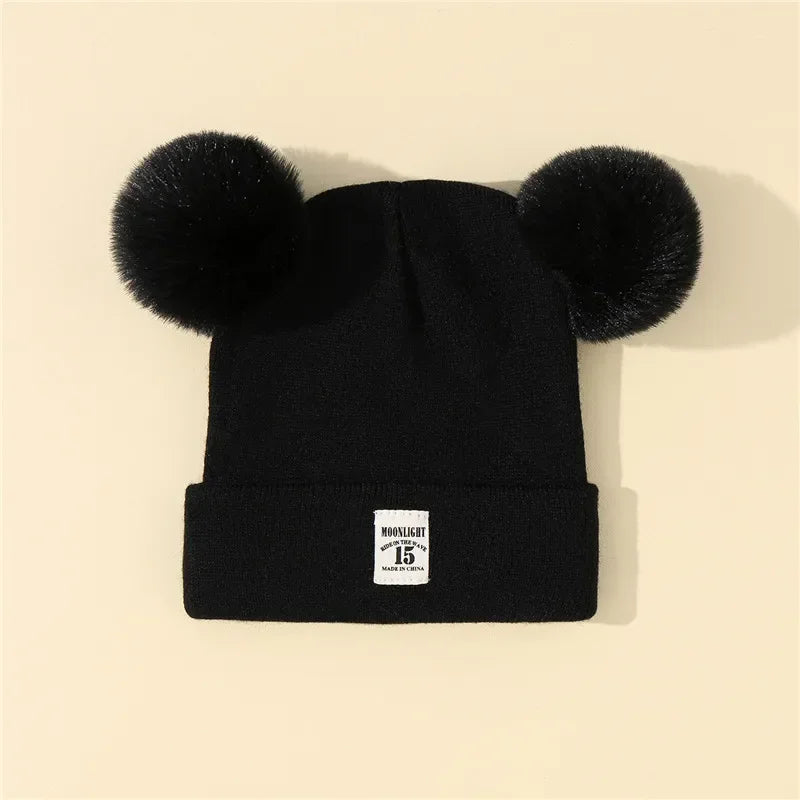 Gorro de bebé con pompones