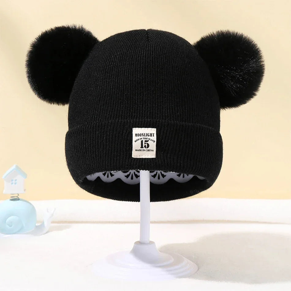 Gorro de bebé con pompones