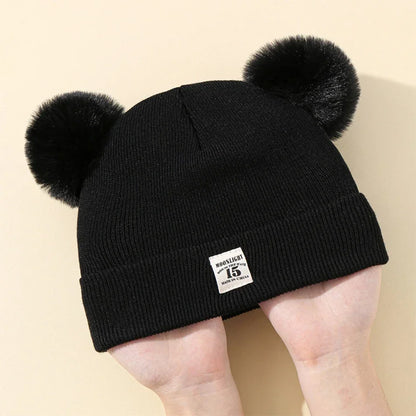 Gorro de bebé con pompones