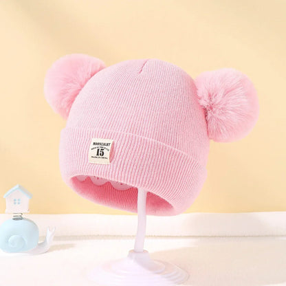 Gorro de bebé con pompones